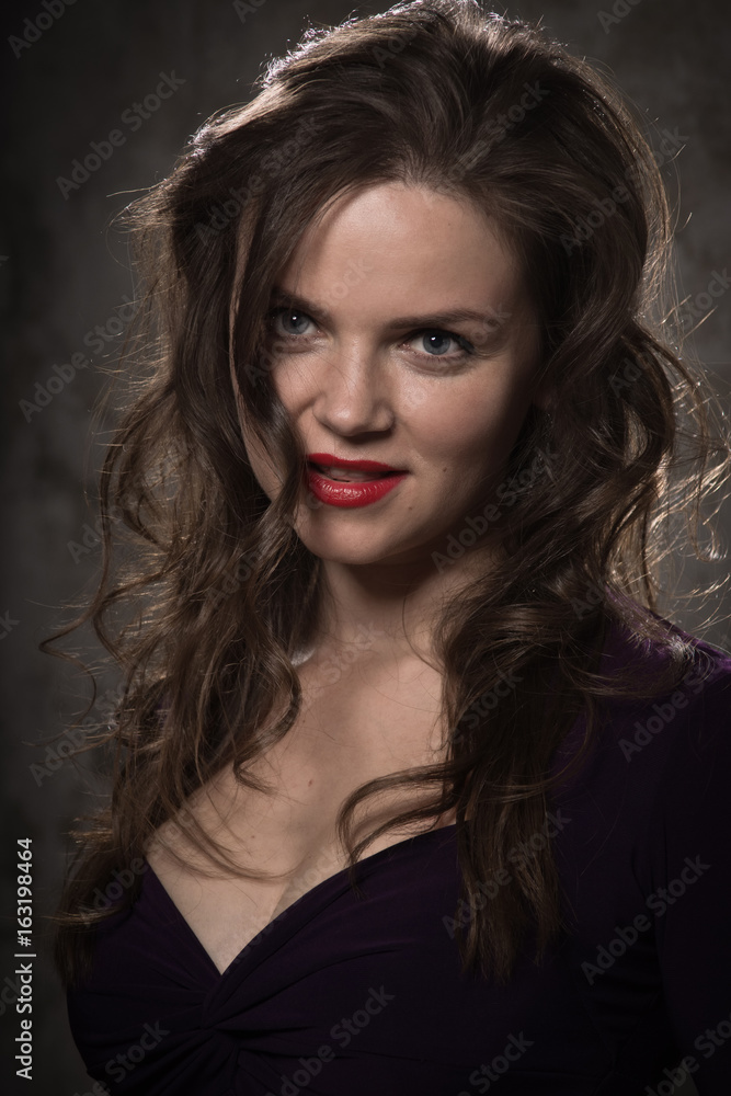 Beautiful young woman dressed in black dress in a vintage interior Beautiful young woman dressed in black dress in a vintage interior