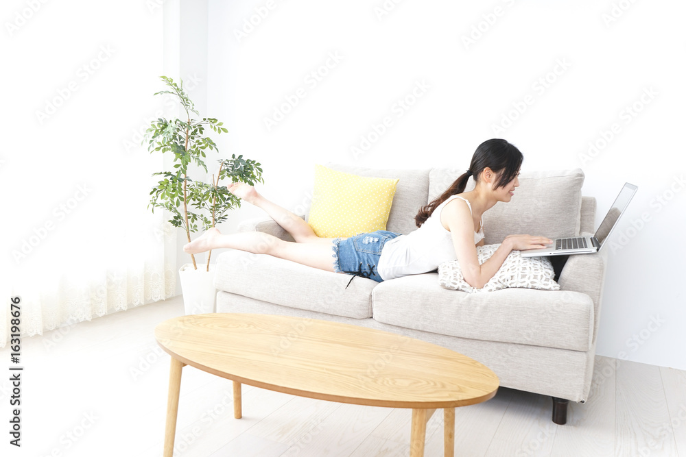 Young woman using a computer with relax Young woman using a computer with relax