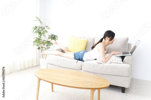Young woman using a computer with relax