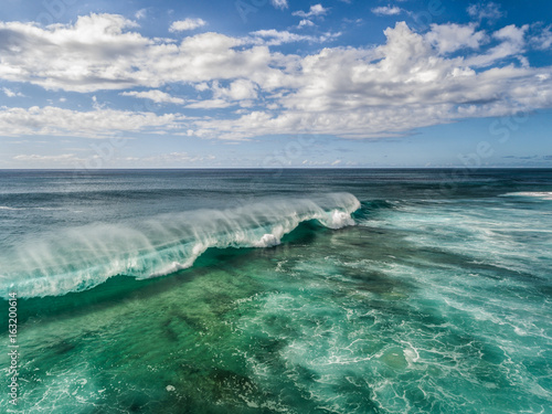 Aerial view of a breaking Ocean wave on the north shore of Oahu Hawaii