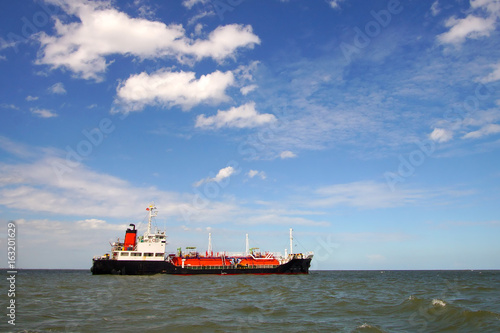 Lpg tanker at sea and blue sky background , the ship is a gas carrier