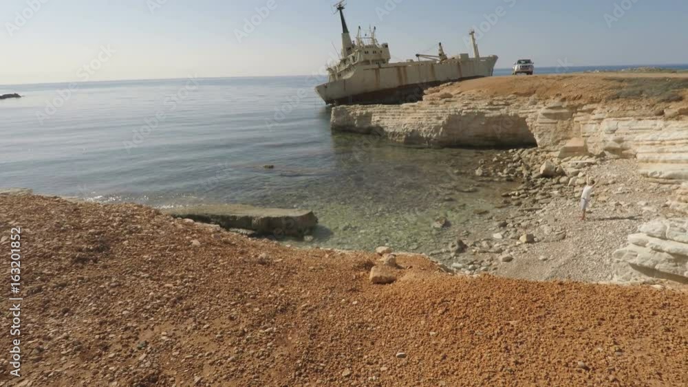 Pretty man turns around on the Mediterranean seashore Pretty man turns around on the Mediterranean seashore