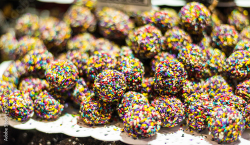 Colorful chocolate truffle candies at a street food market