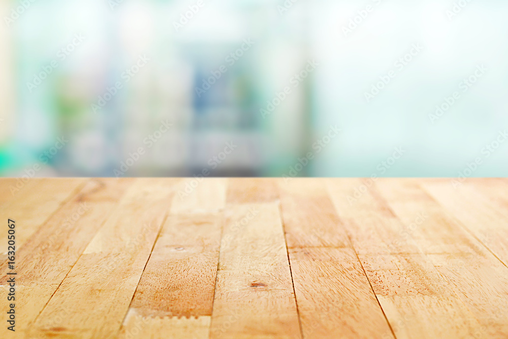 Wood table top on blur white green abstract background Wood table top on blur white green abstract background