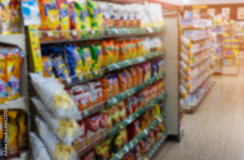 Grocery on shelf in small supermarket   blurred effect