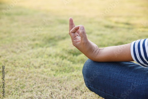 Woman meditating in a yoga pose.