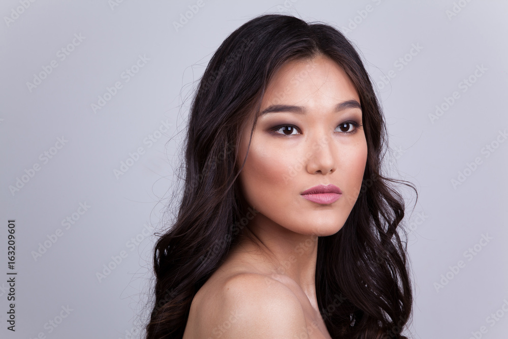 Portrait of a beautiful asian woman with naked shoulders. Portrait of a beautiful asian woman with naked shoulders.
