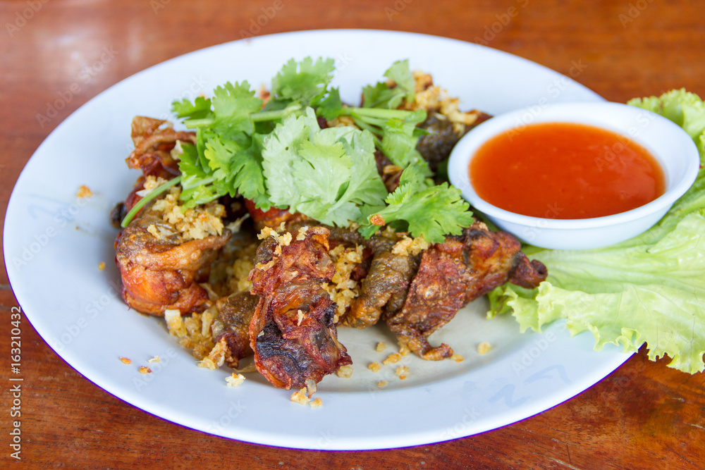 Fried frog in a dish