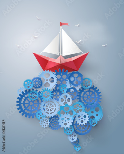 Concept of leader vision and thinking, paper boat sailing float on the brain gear,paper art and craft style