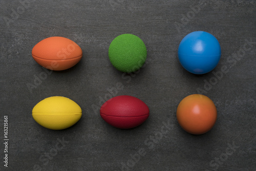 colorful of stress balls on black background