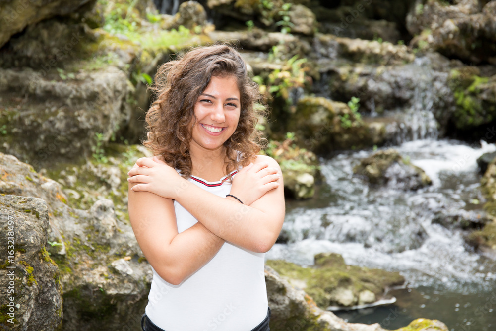 Outdoor portrait of Caucasian teenage girl standing on a rivercoast Outdoor portrait of Caucasian teenage girl standing on a rivercoast