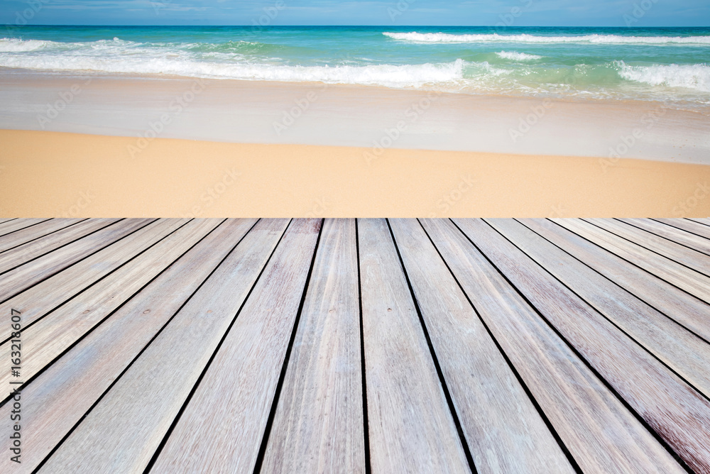 wooden terrace with Sand beach and tropical sea wooden terrace with Sand beach and tropical sea