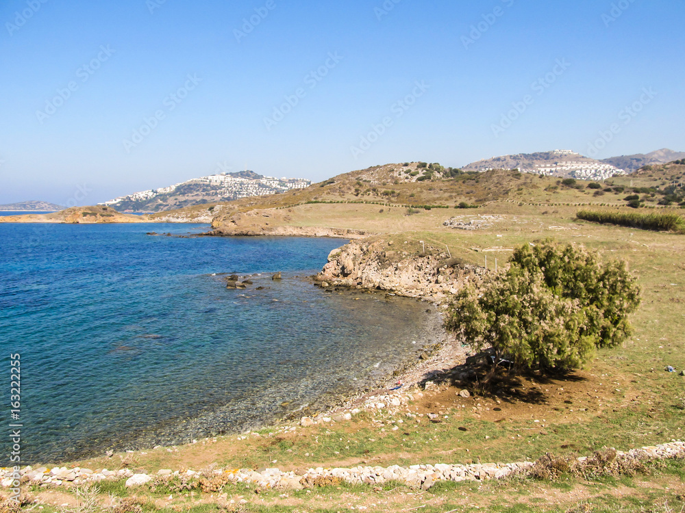 A beach in Gumusluk - seaside village and fishing port in Bodrum, Turkey