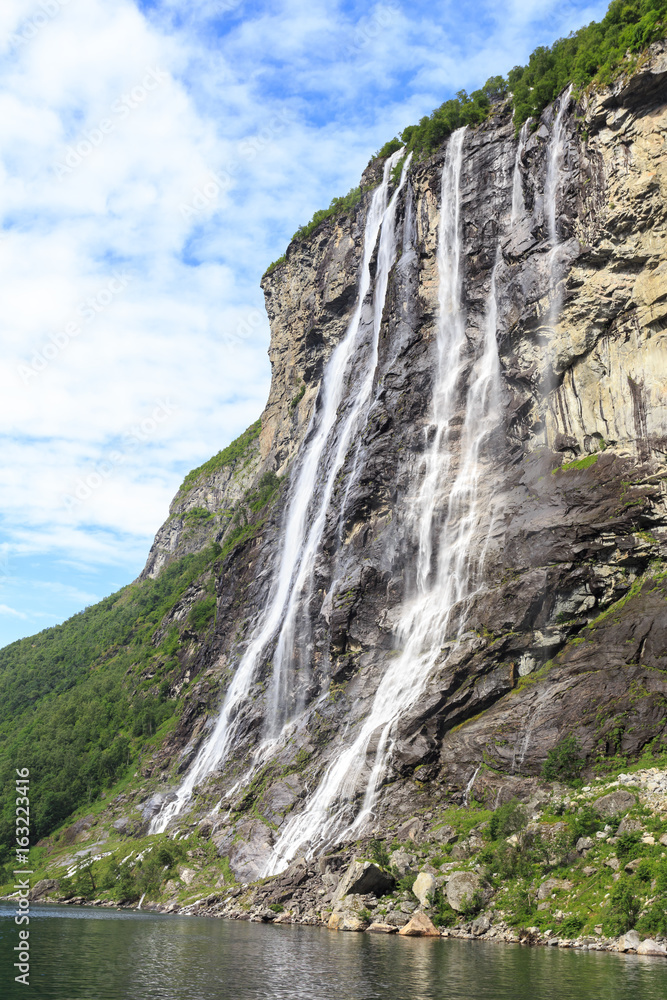 Seven Sisters Waterfall in Geiranger Fjord, Norway.  It consists of seven separate streams, and tallest of seven has a free fall that measures 250 metres