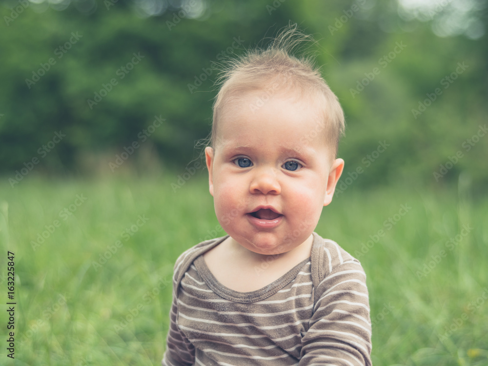 Cute little baby sitting in nature Cute little baby sitting in nature