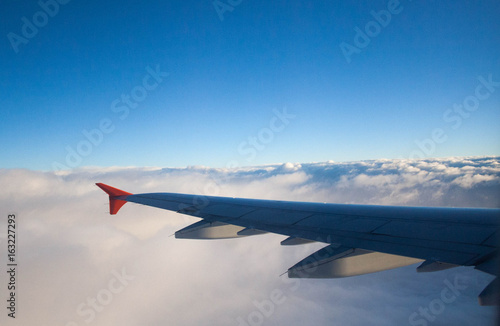 Wing in the clouds