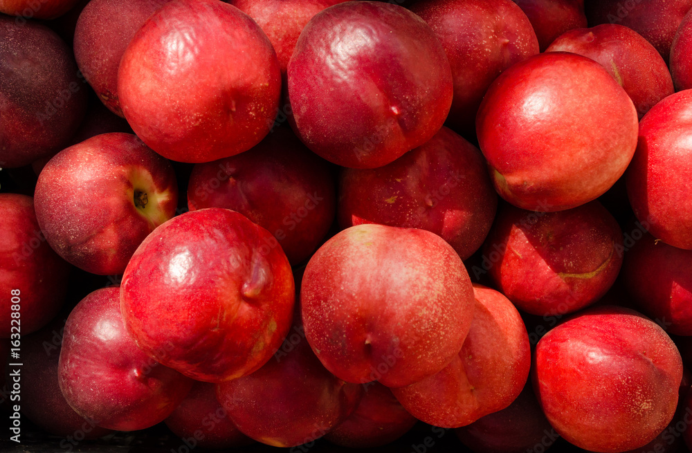 Fresh nectarine close up. Colorful fruit background