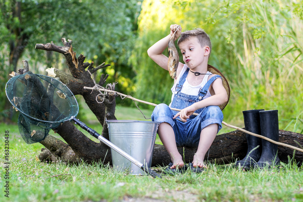 Little boy fishing Stock Photo