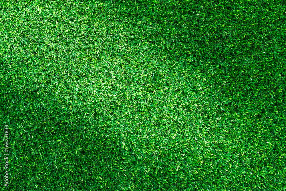 Fototapeta premium Artificial green grass texture for golf course, soccer field or sports background concept design.