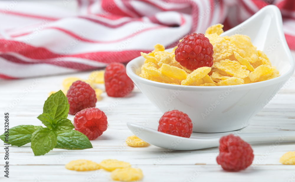 Cornflakes with fresh raspberries. Healthy Breakfast. Selective focus Cornflakes with fresh raspberries. Healthy Breakfast. Selective focus