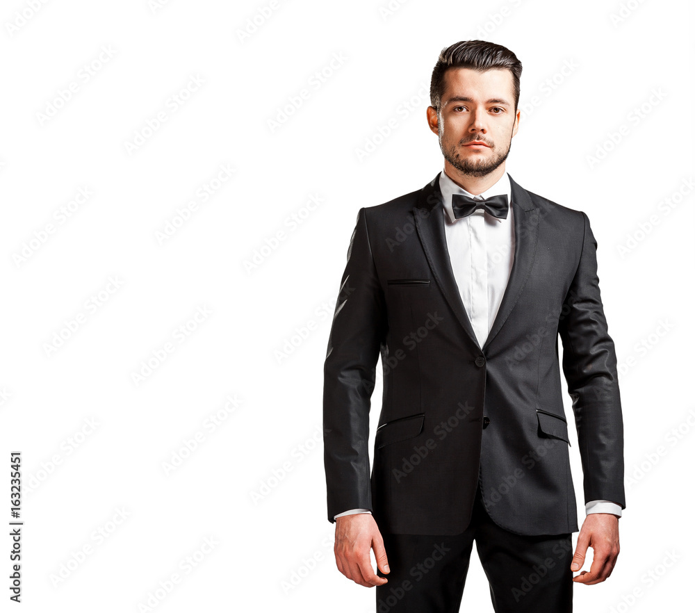 portrait of confident handsome man in black suit with bowtie portrait of confident handsome man in black suit with bowtie