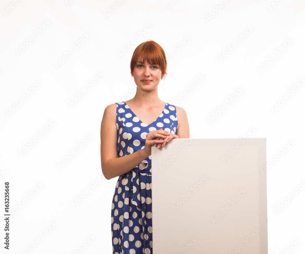 Young glad woman portrait of a confident businesswoman showing presentation, pointing placard background. Ideal for banners, registration forms, presentation, landings, presenting concept. Young glad woman portrait of a confident businesswoman showing presentation, pointing placard background. Ideal for banners, registration forms, presentation, landings, presenting concept.