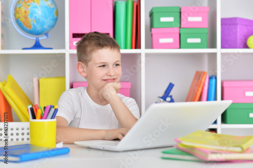 Boy using modern laptop