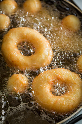 Vászonkép Frying tasty and homemade donuts on fresh oil
