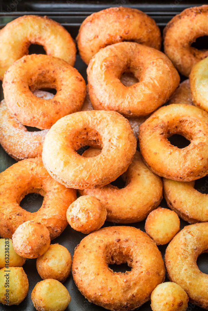 Yummy and homemade golden donuts freshly baked Yummy and homemade golden donuts freshly baked