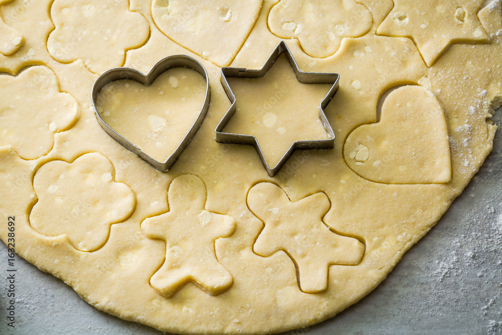 Cutting from fresh dough tasty milky biscuits Cutting from fresh dough tasty milky biscuits