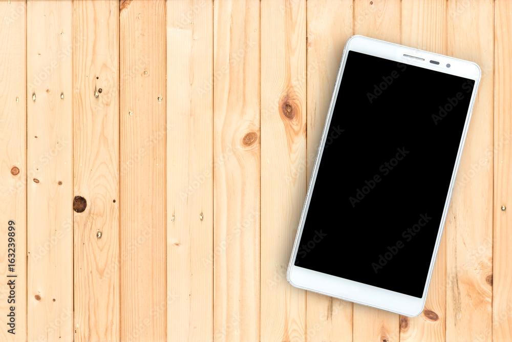 Smart phone with black screen on wooden background. Smart phone with black screen on wooden background.