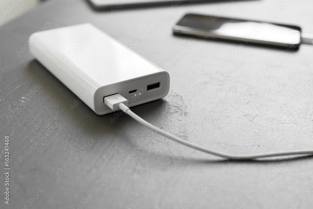 Fototapeta premium Smartphone charging with power bank