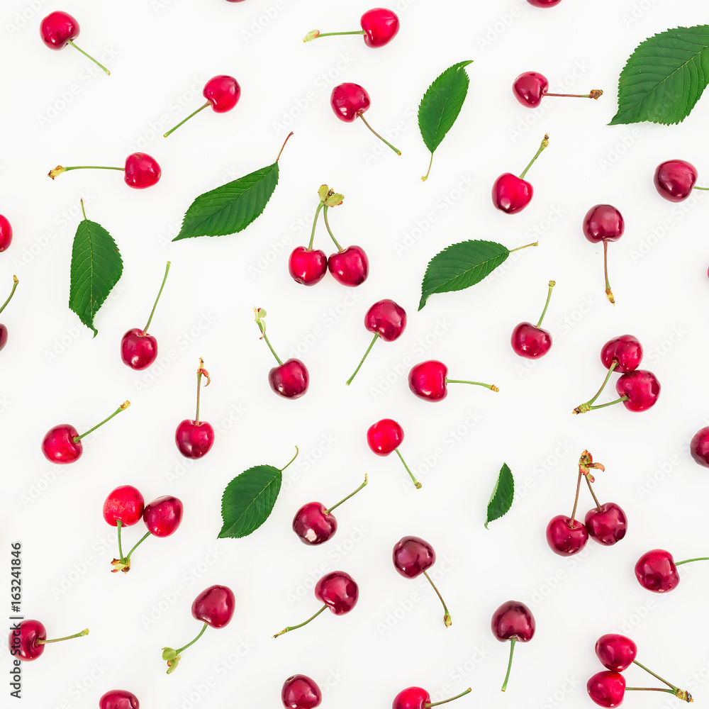 Cherry and leaves isolated on white background. Flat lay. Top view. Summer berries Cherry and leaves isolated on white background. Flat lay. Top view. Summer berries