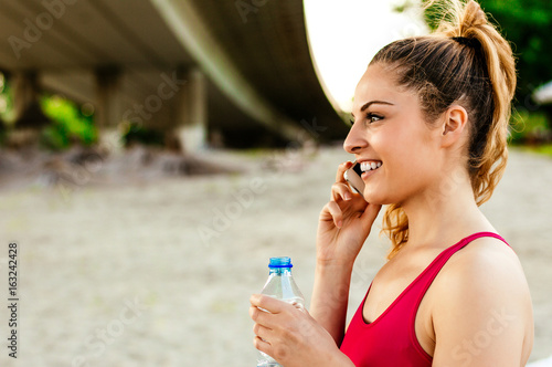 Woman on the beach talking on phone