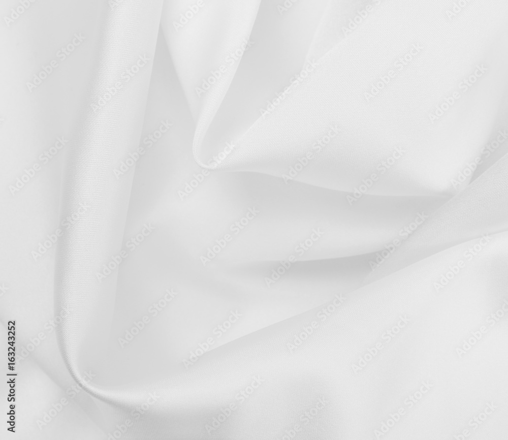 Smooth elegant white silk or satin luxury cloth texture as wedding background. Luxurious background design Smooth elegant white silk or satin luxury cloth texture as wedding background. Luxurious background design