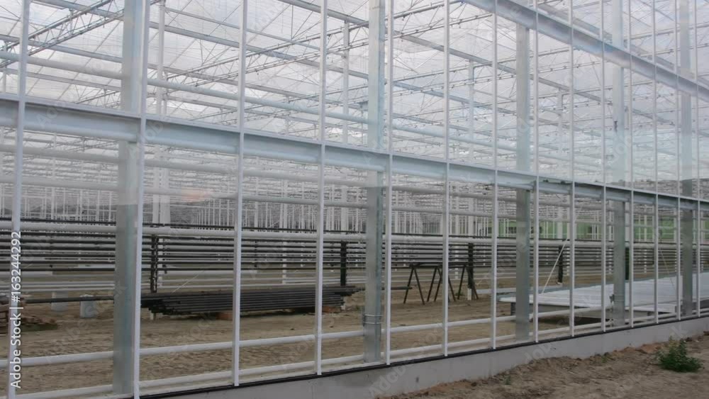 Constructin of industry greenhouse. Building of industry hothouse Constructin of industry greenhouse. Building of industry hothouse