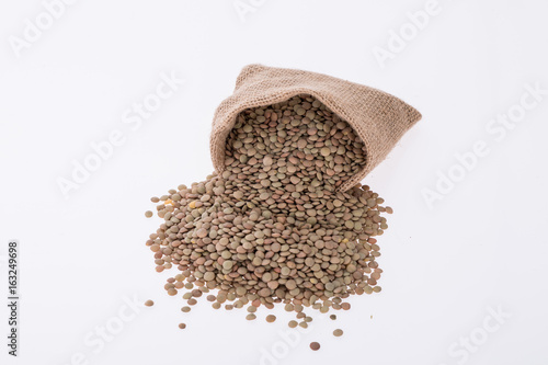 Raw lentils on white background