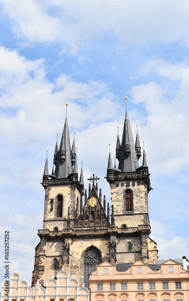 Church of Our Lady before Týn in the Old Town Square in Prague, Czech Republic, with blue sky and white clouds in the background. Copy space.