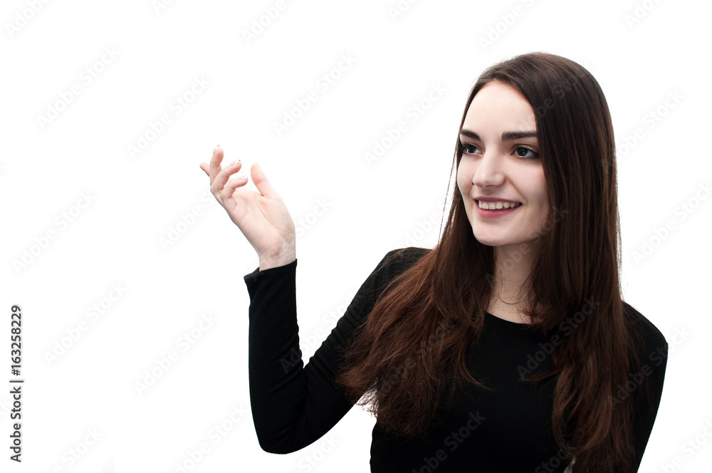 Half-length portrait of beautiful smiling woman with long hair and brown eyes in black blouse pointing up with blank text space, isolated on white. Half-length portrait of beautiful smiling woman with long hair and brown eyes in black blouse pointing up with blank text space, isolated on white.