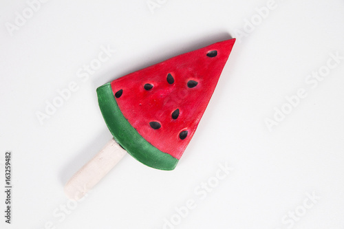 watermelon shaped ice cream pop on white background