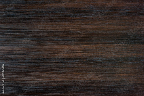 close up view of empty dark wooden tabletop background