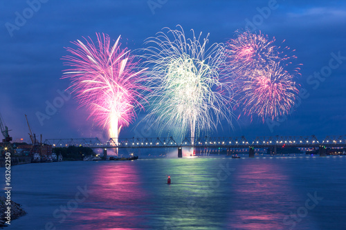 Colorful fireworks festival at the river. 