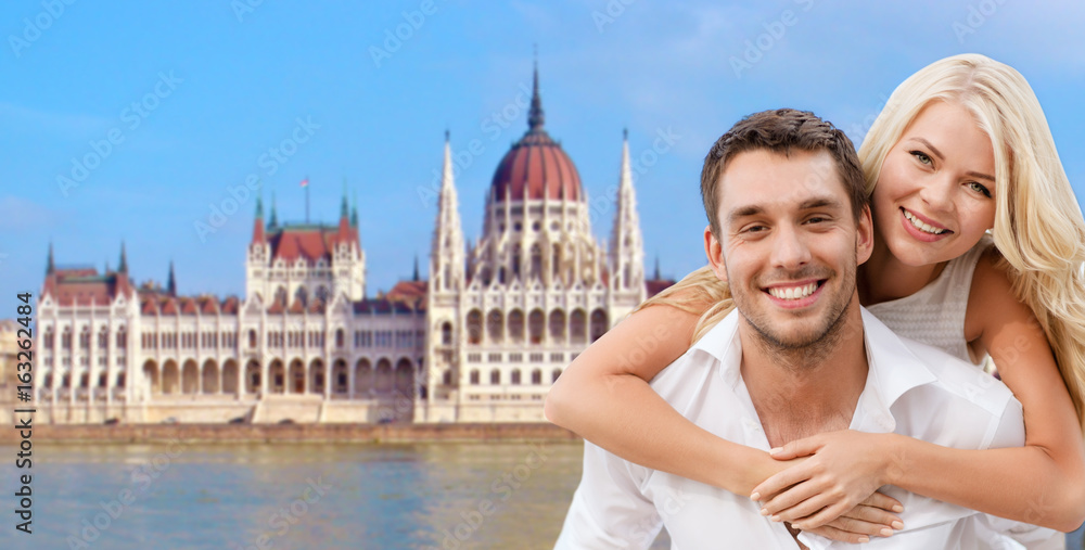 Fototapeta premium happy couple over house of parliament in budapest
