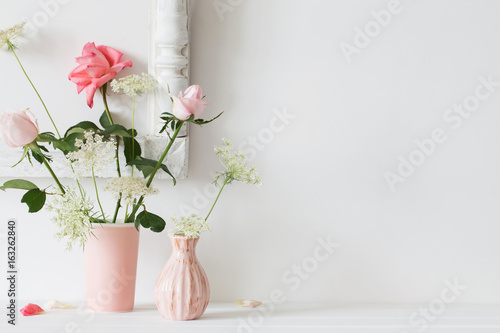 Roses in a vase on a white background