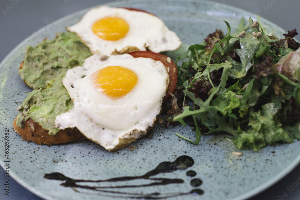 Fresh breakfest, fried eggs and salad Fresh breakfest, fried eggs and salad