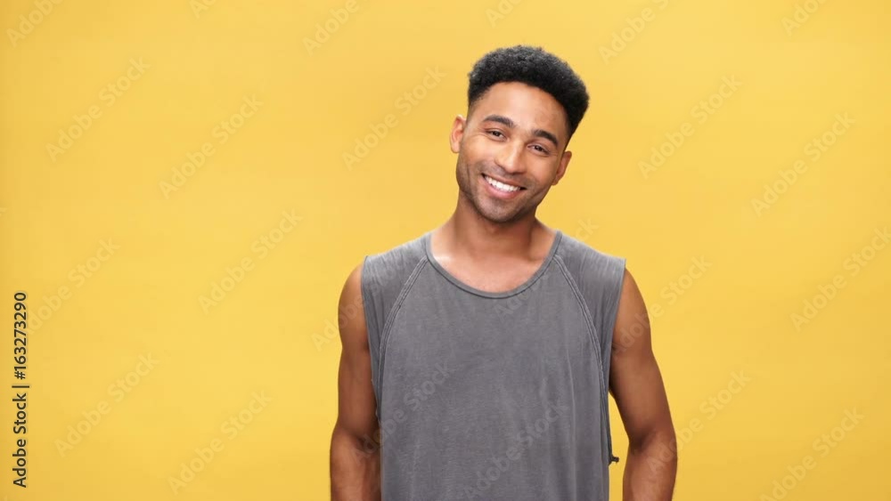 Young happy african man over yellow background Young happy african man over yellow background