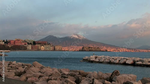 Napoli, vista da Mergellina sullo sfondo Castel dell'ovo e il Vesuvio innevato photo