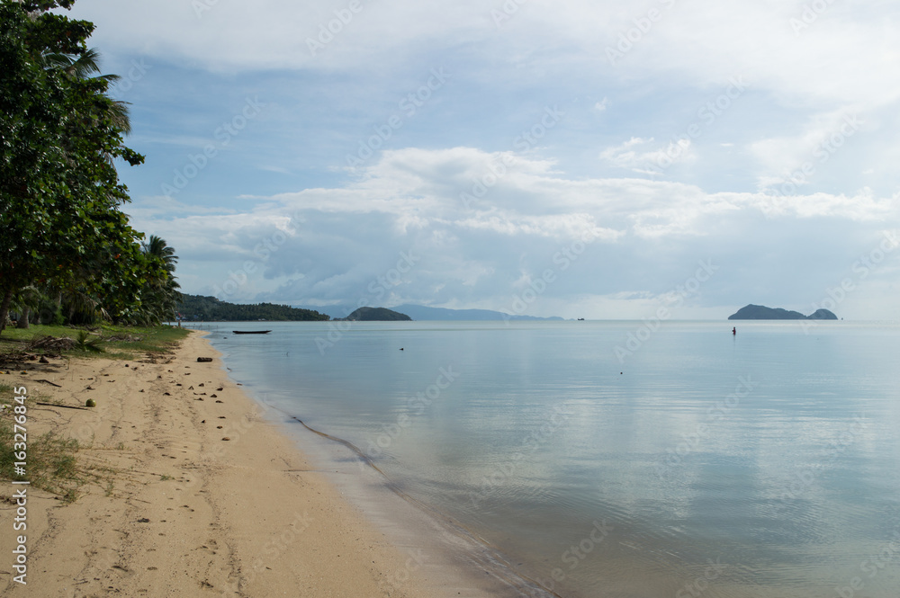 Beautiful Bay and Beach with Palms and Fisherman in the Water on Koh Pha Ngan, Thailand