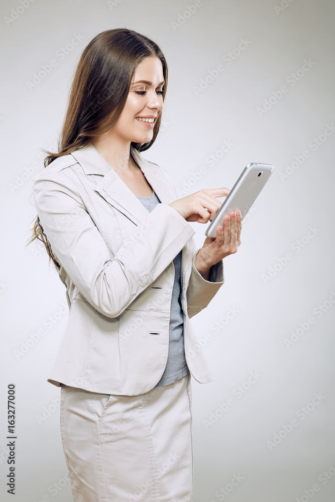Business woman suit wearinf using tablet for work. Business woman suit wearinf using tablet for work.