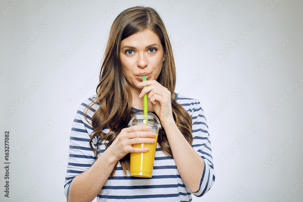 Woman drinking orange juice isolated Woman drinking orange juice isolated